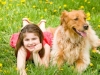 Little Girl Laying Down With Dog